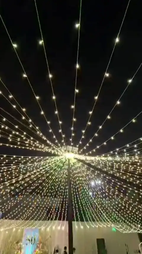 The light canopy over the lawn, seen while walking around its centre pole