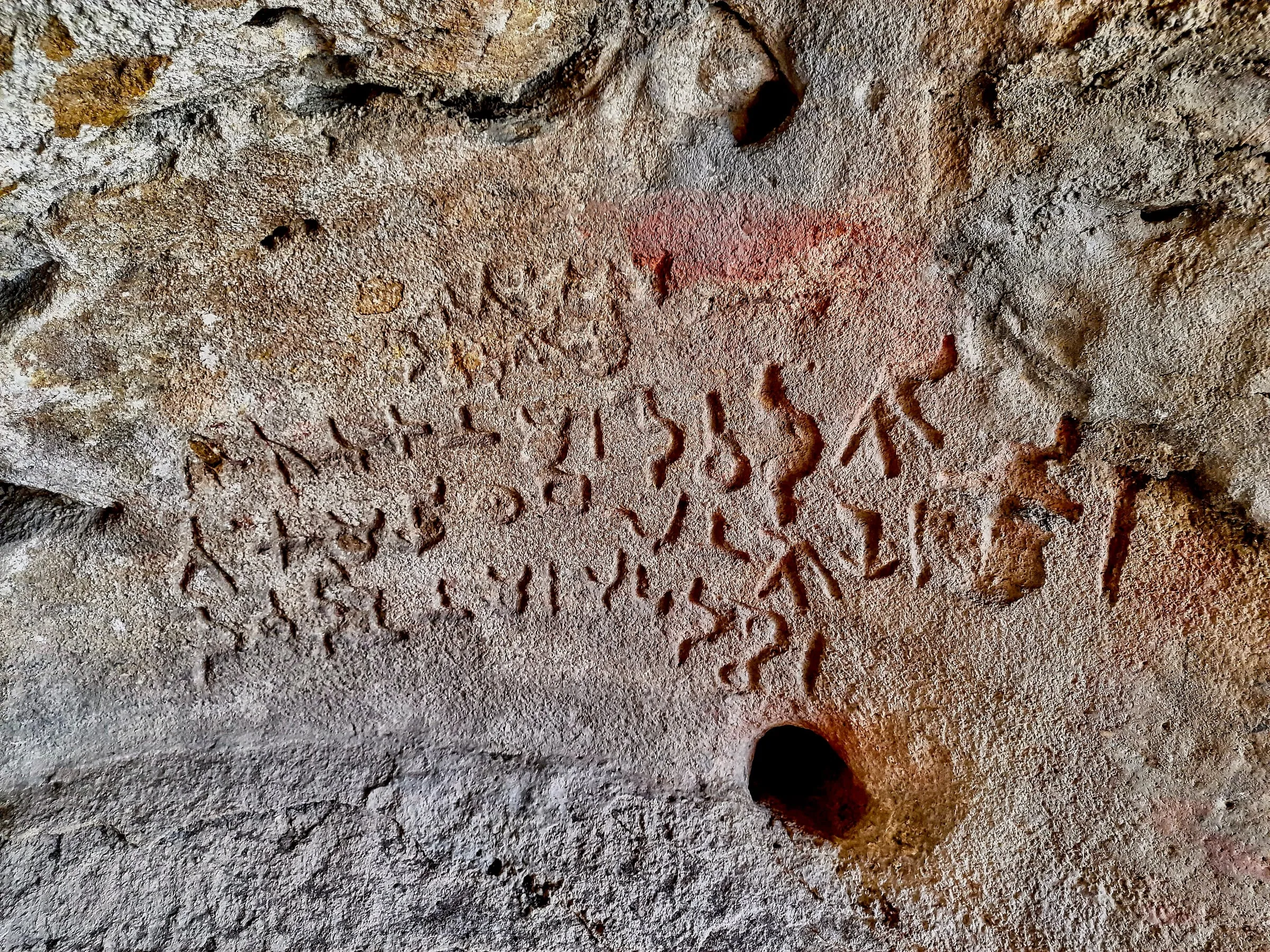 An ancient Brahmi inscription cut into the rock